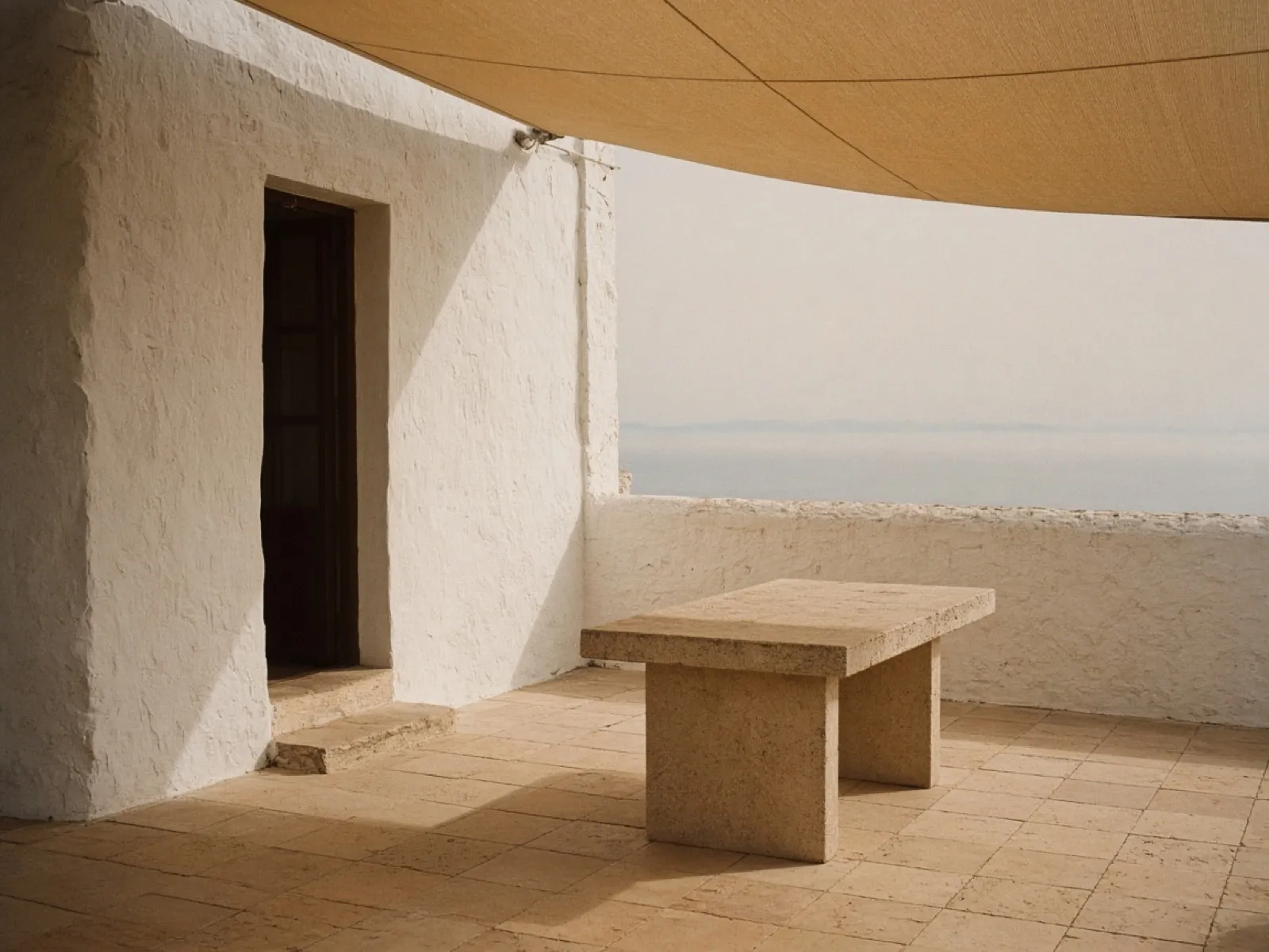 An empty shaded terrace above the sea in the Algarve